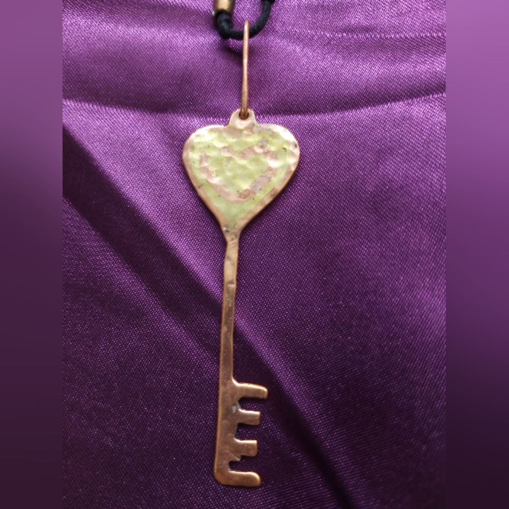 new! handcrafted copper heart key necklace with heart design.